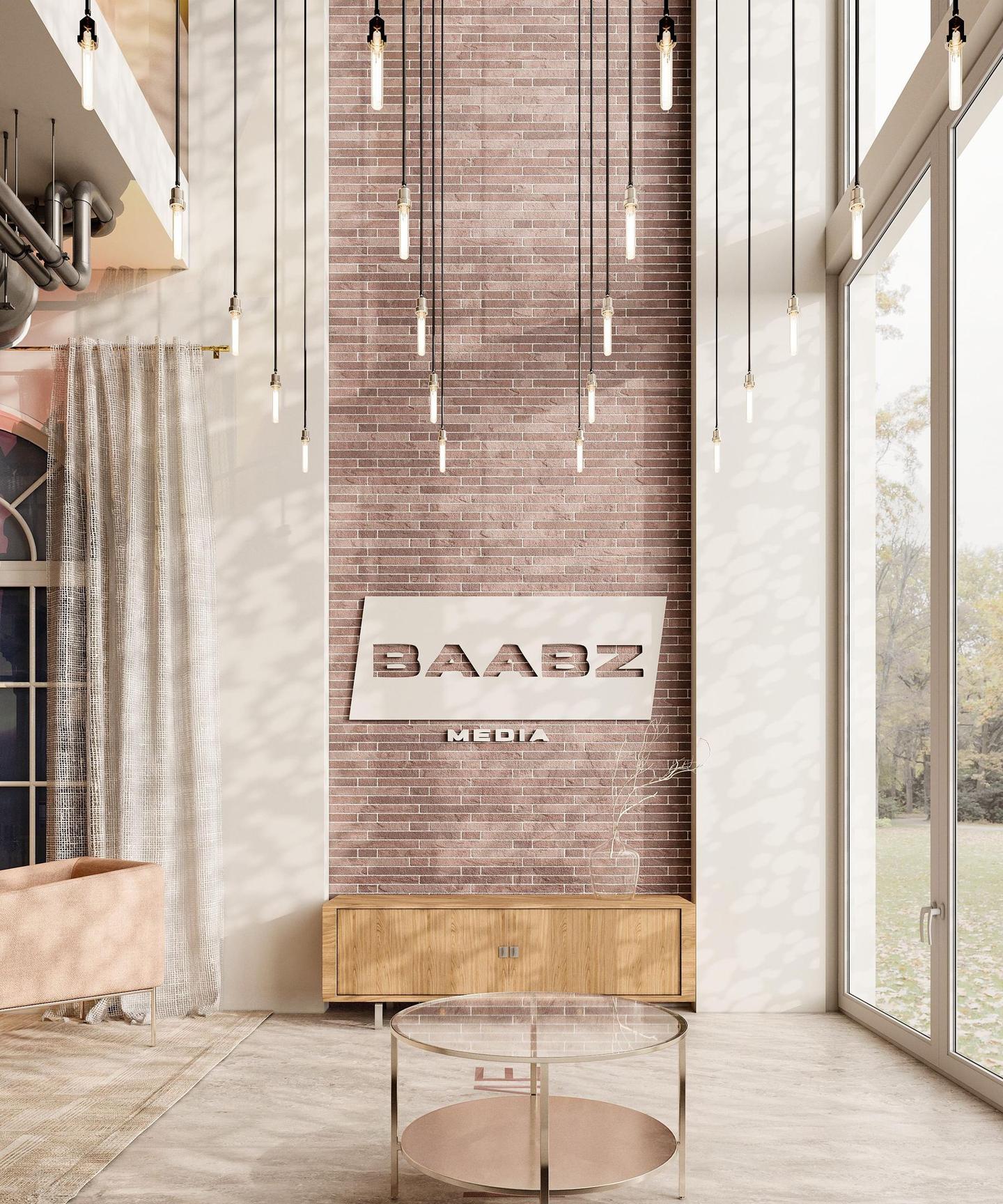The brand wall, Baabz Media cut out in white on brick