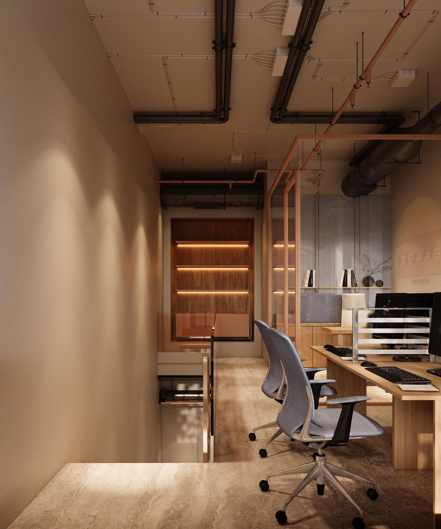 Edit bay on the mezzanine, dual monitors behind a glass partition